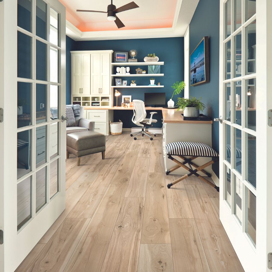 light wide wood plank natural laminate flooring in home office space